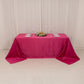 Fuchsia seamless satin tablecloth for a 6-foot table with floor-length drop.