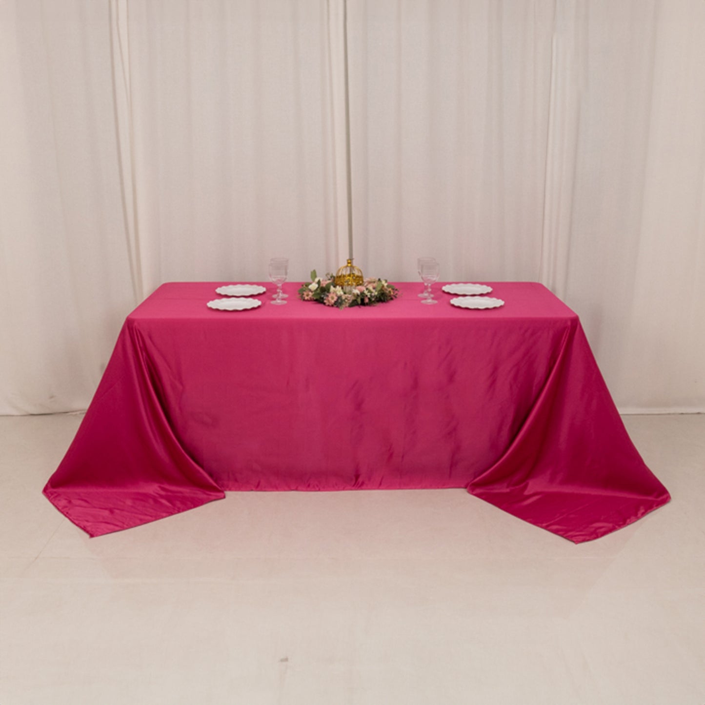 Fuchsia seamless satin tablecloth for a 6-foot table with floor-length drop.