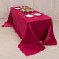 Fuchsia satin rectangle tablecloth for 6 foot table with floor-length drop.