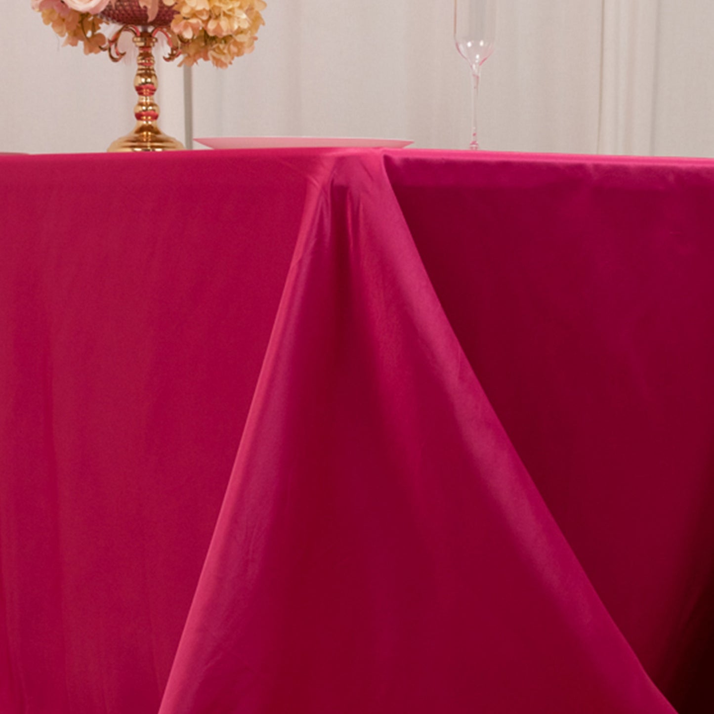 Fuchsia satin tablecloth draping elegantly over a 6-foot table.