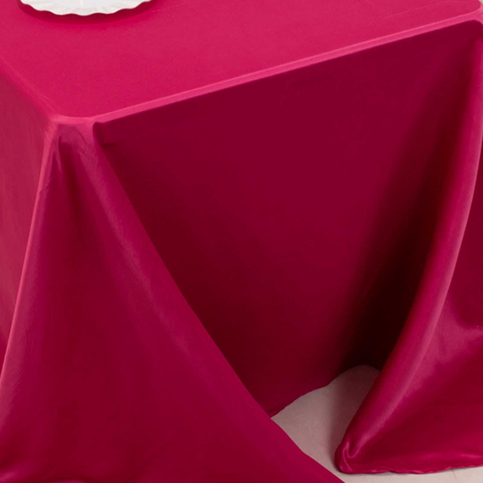 Fuchsia satin tablecloth draping elegantly over a 6-foot table.