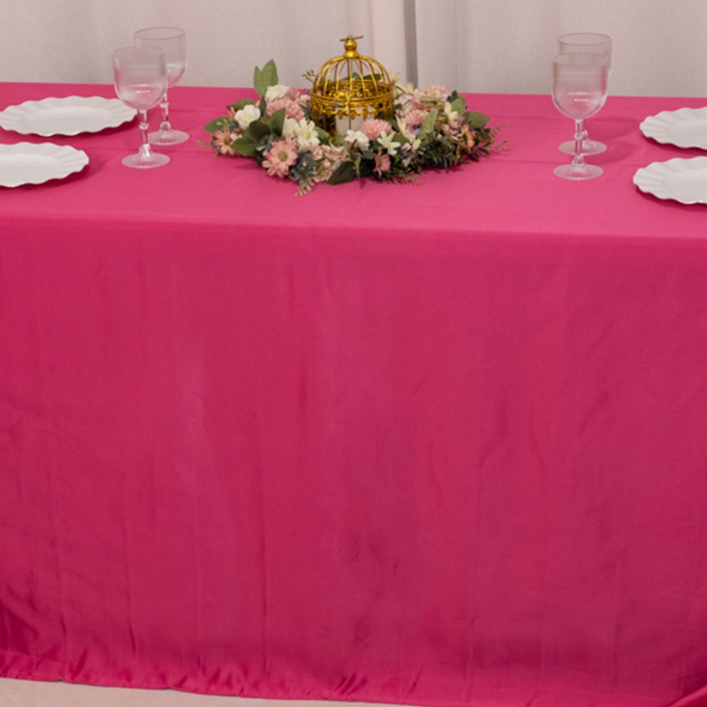 Fuchsia seamless satin tablecloth for 6-foot table with floor-length drop.