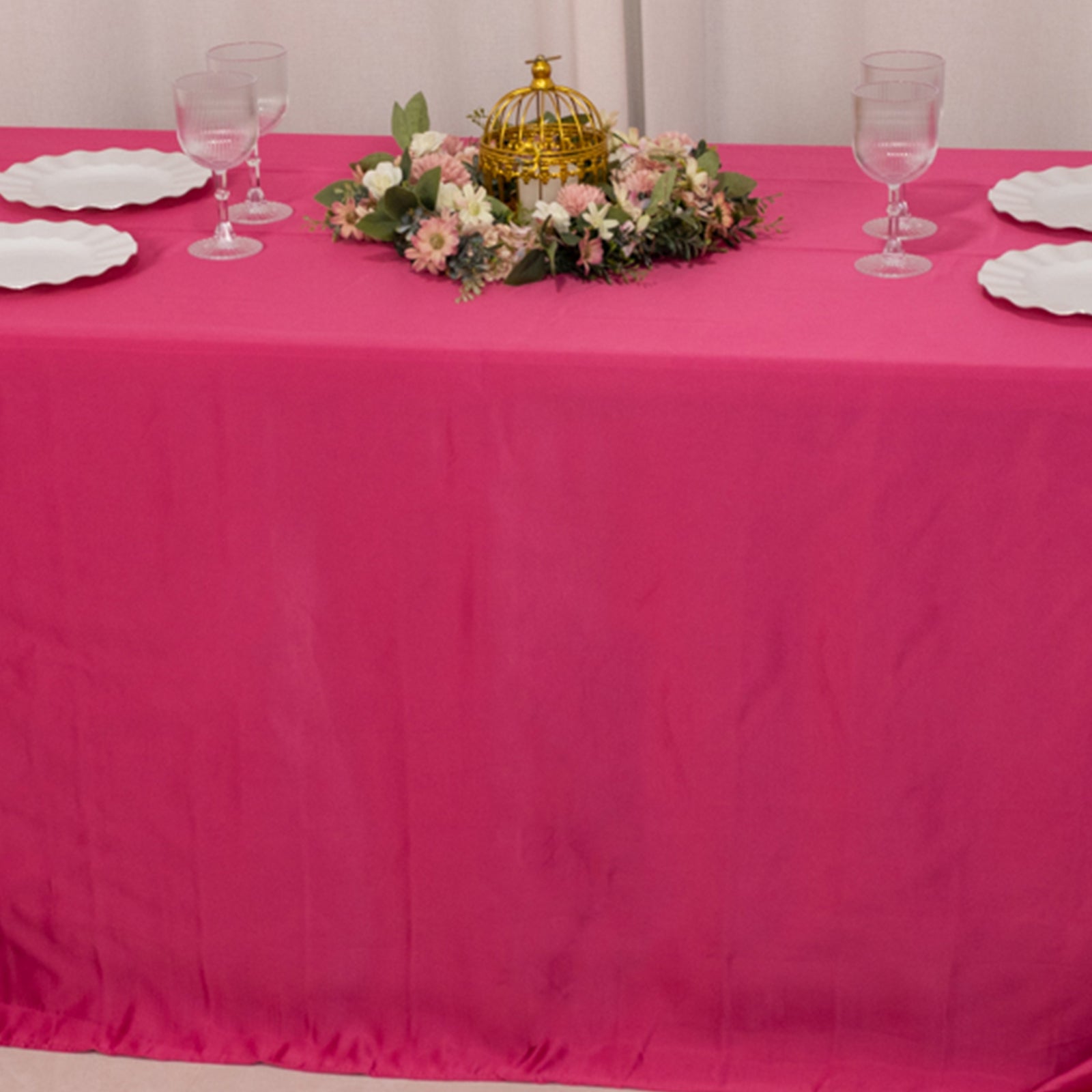 Fuchsia seamless satin tablecloth for 6-foot table with floor-length drop.