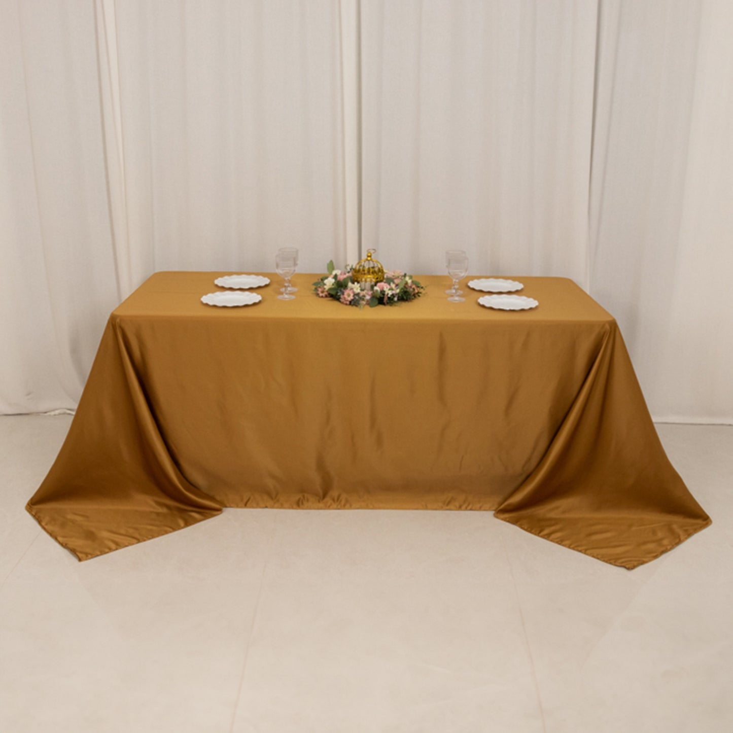 Gold rectangle tablecloth for 6 foot table with floor-length drop.