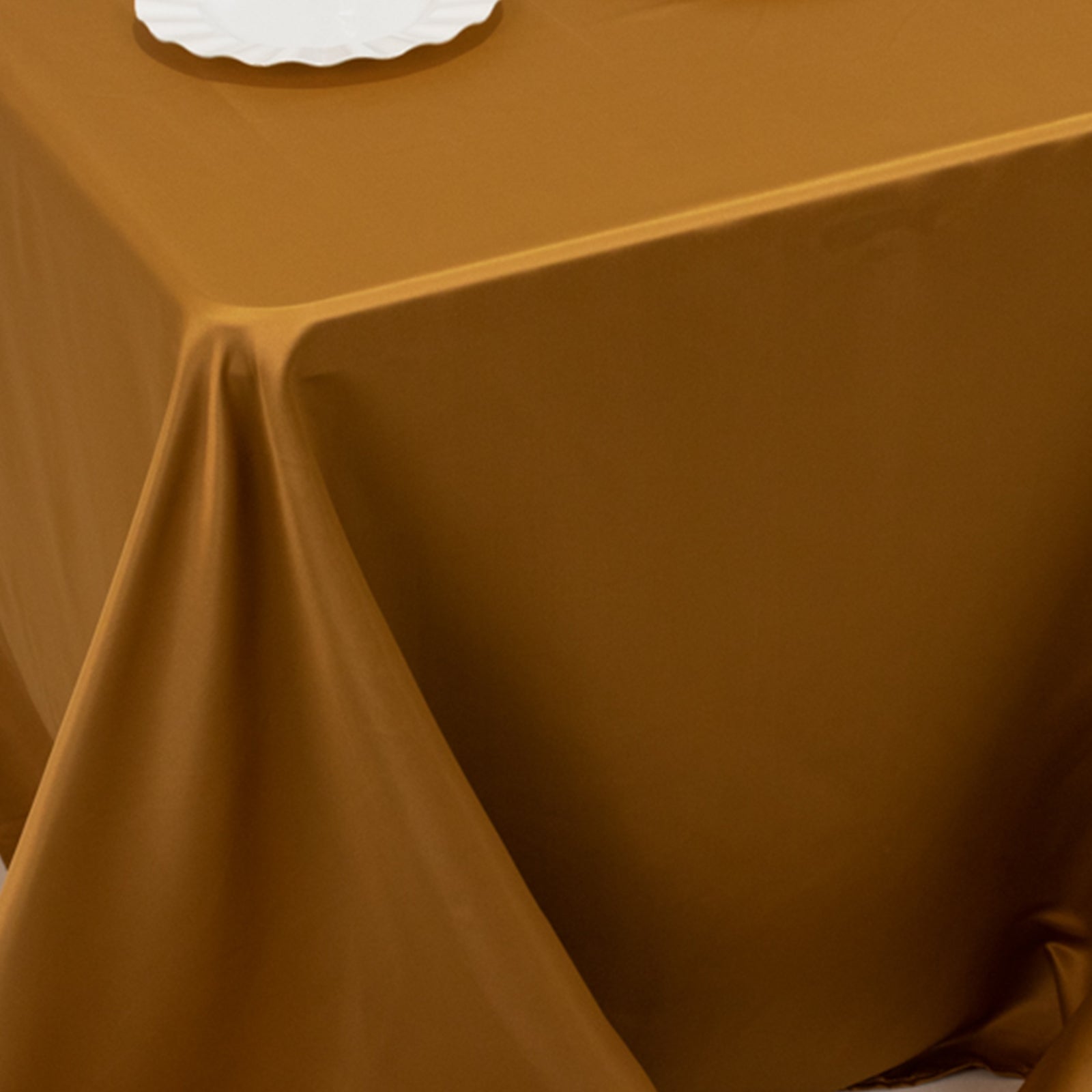 Gold satin tablecloth for 6 foot table with floor-length drop.