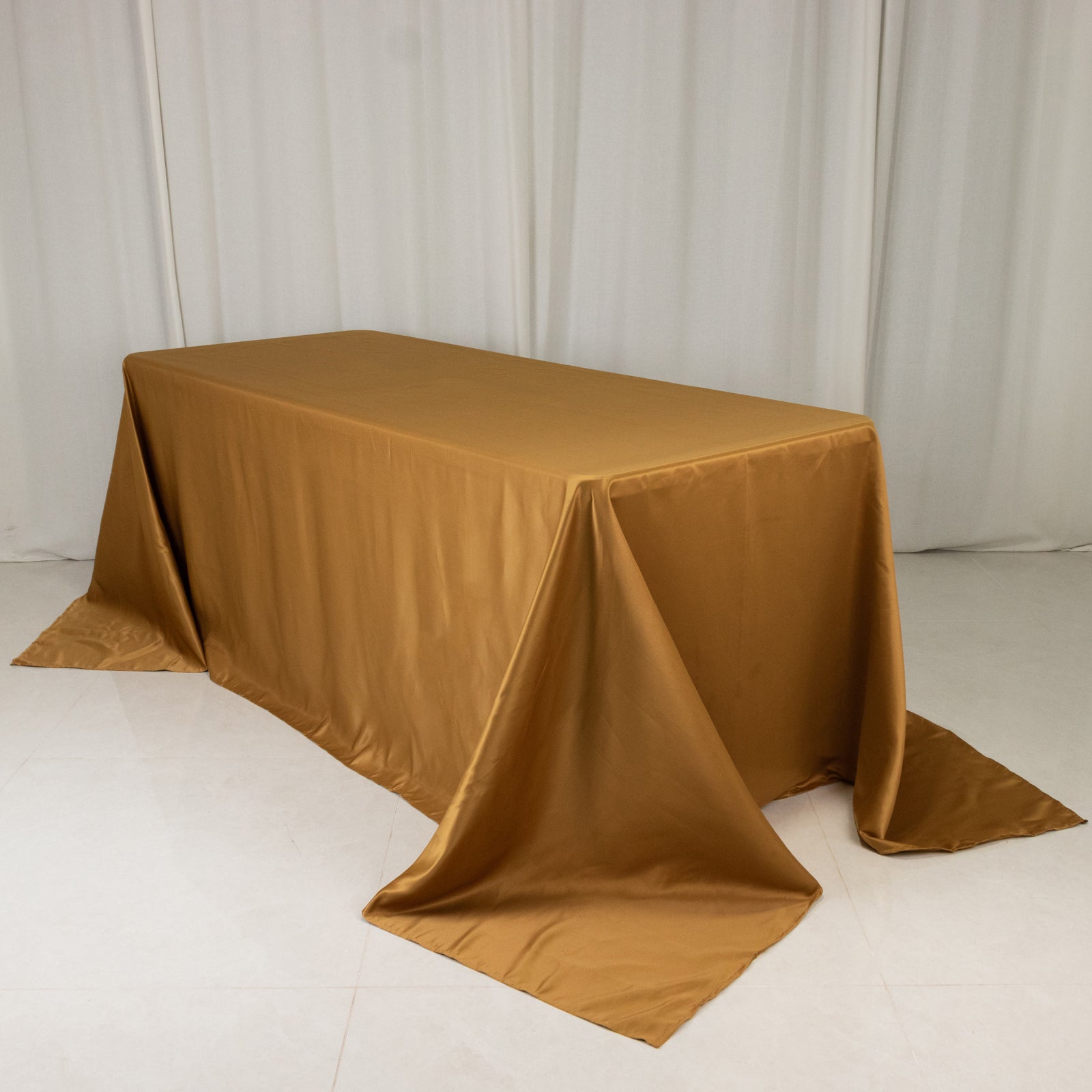 gold satin rectangle tablecloth for 6 foot table with floor-length drop
