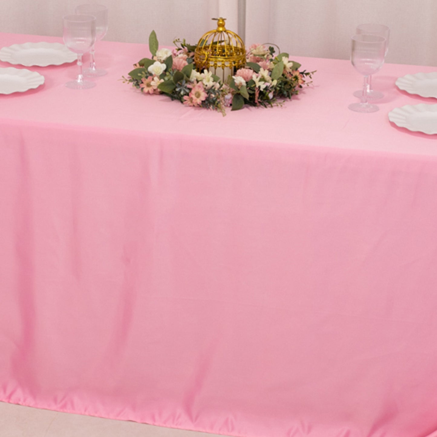 90"x132" pink satin tablecloth for 6 foot table with floor-length drop.