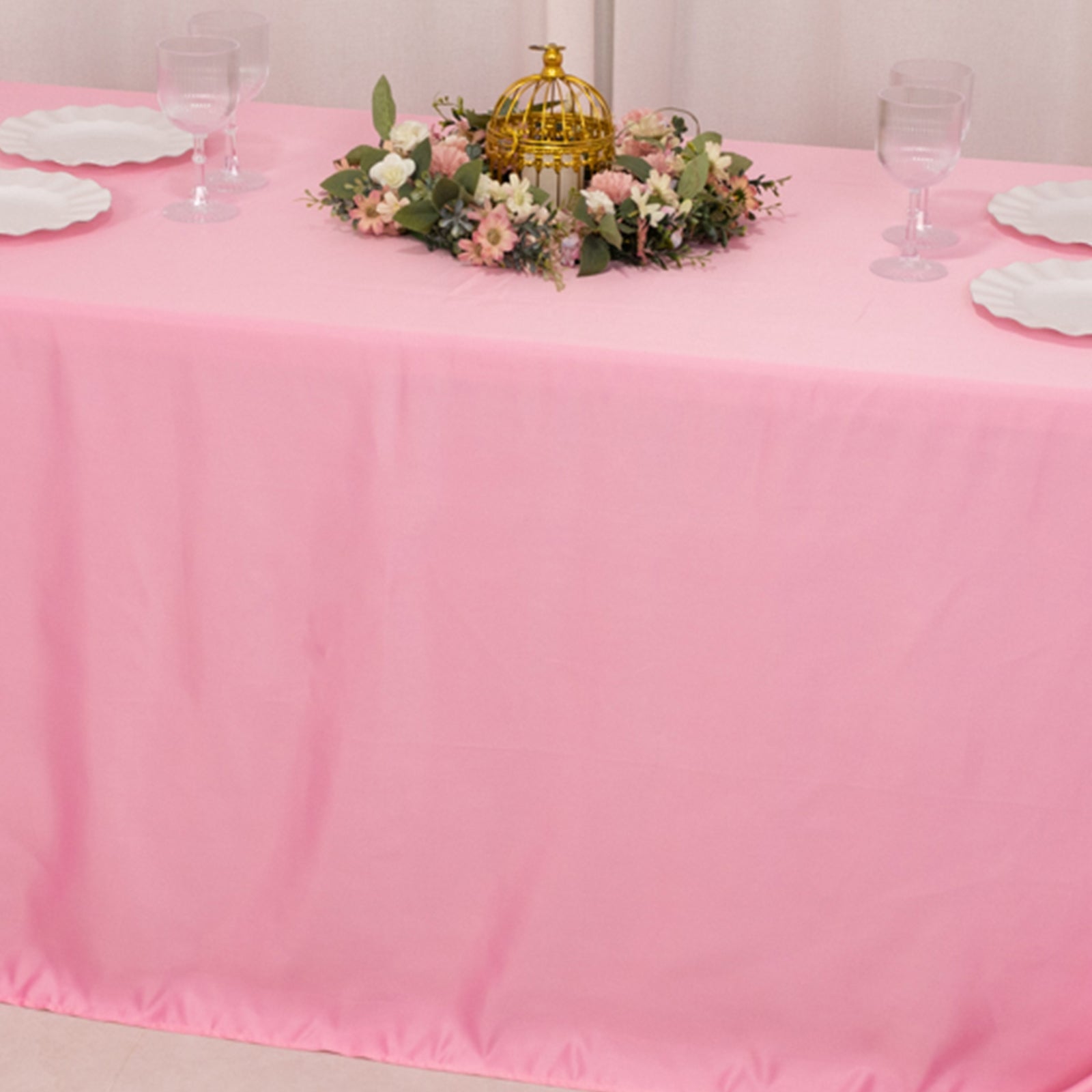 90"x132" pink satin tablecloth for 6 foot table with floor-length drop.