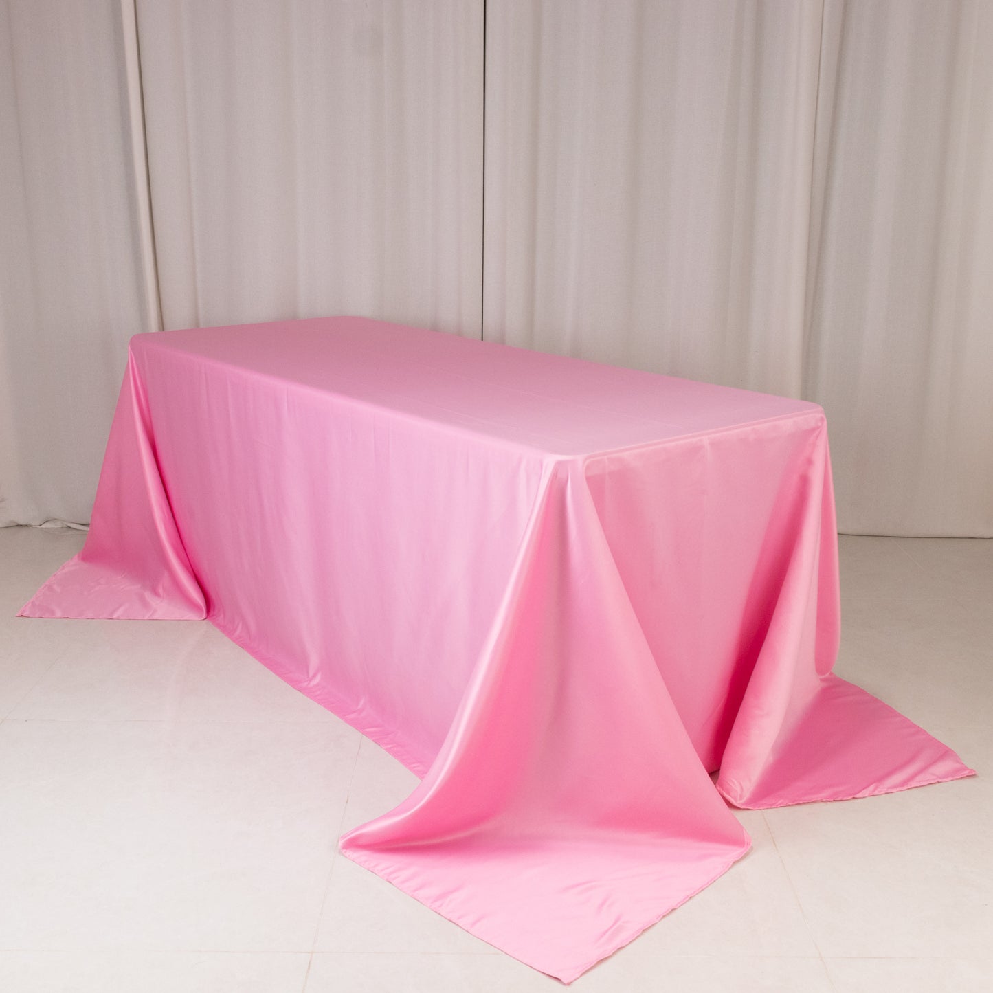 Pink seamless lamour satin rectangle tablecloth for 6 foot table.