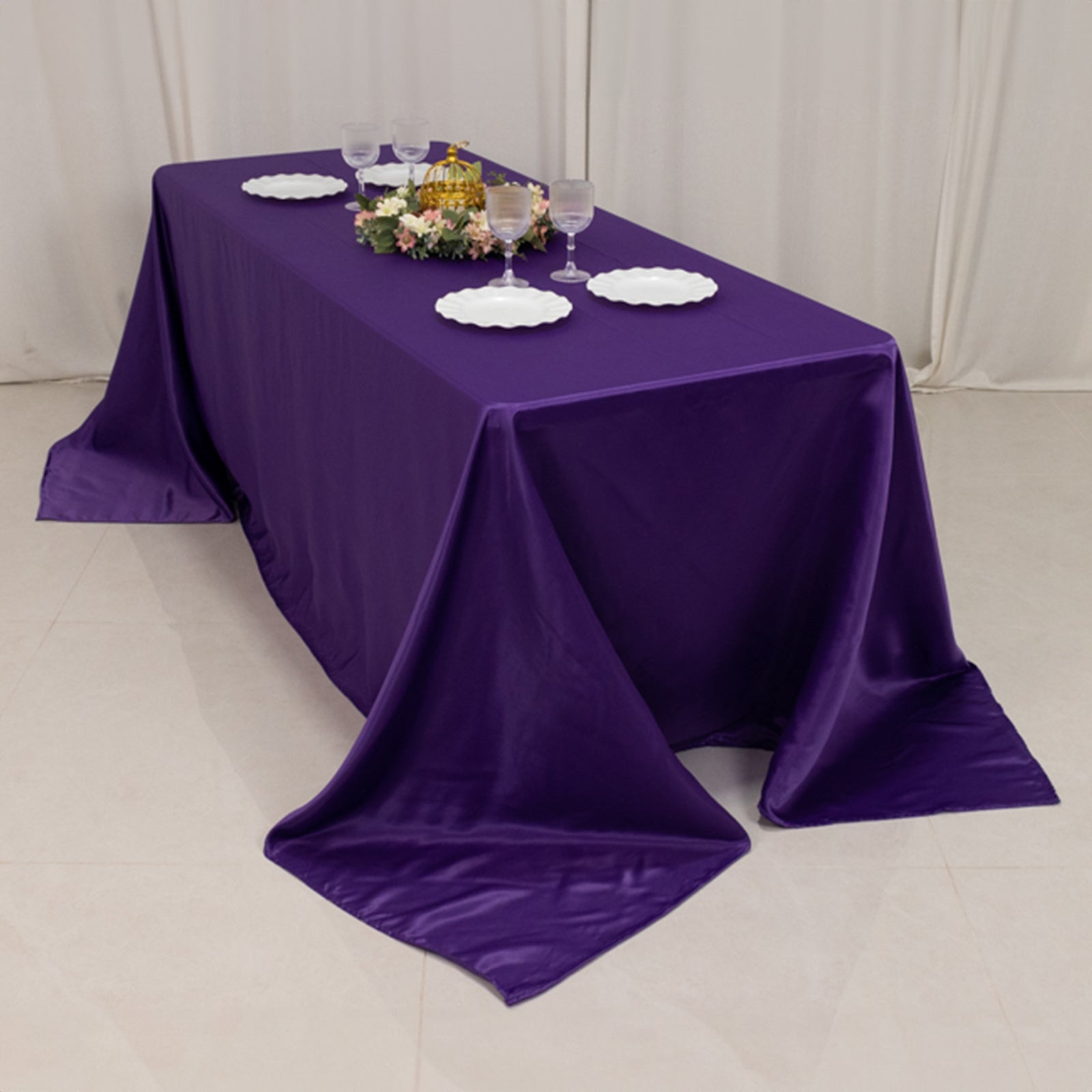 90"x132" purple satin tablecloth for 6 foot table with floor-length drop.
