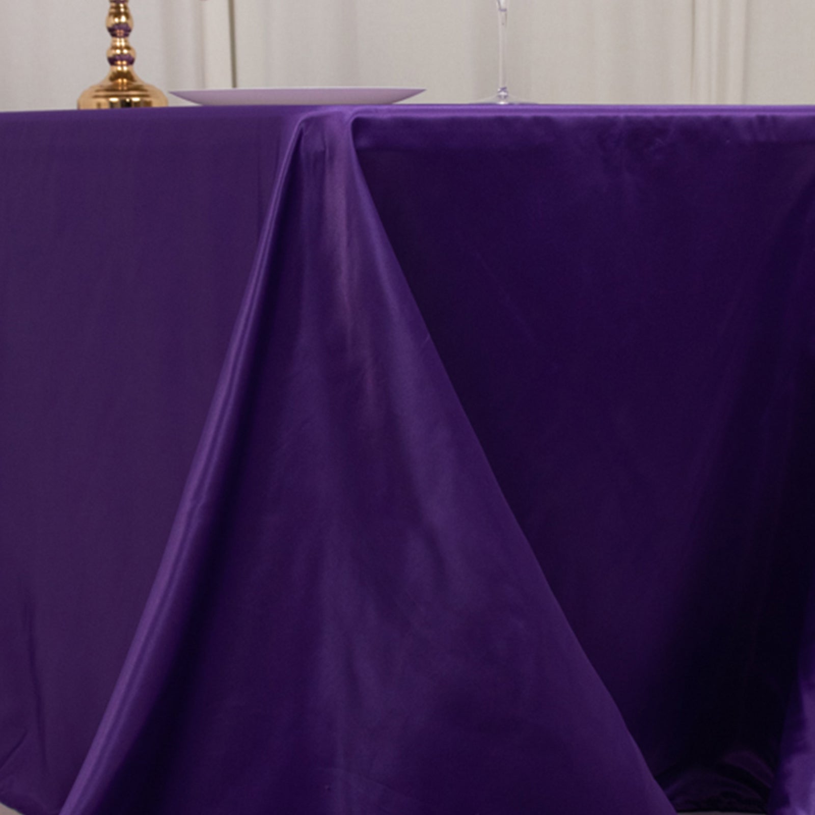 Purple satin tablecloth for 6-foot table with floor-length drop.