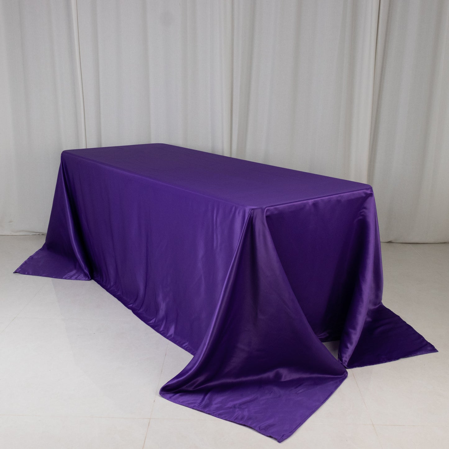 Purple satin tablecloth for 6-foot table with floor-length drop.