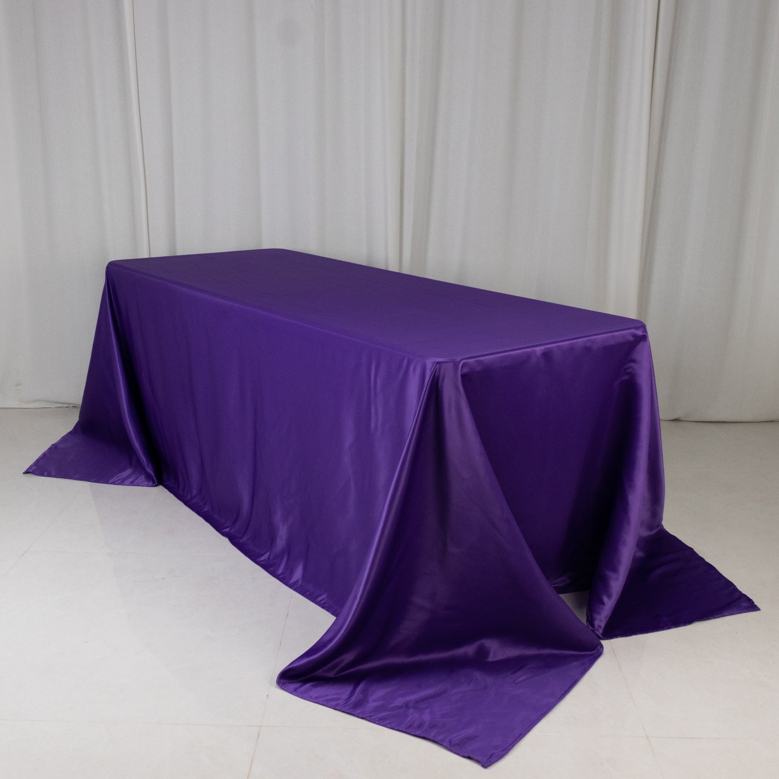 Purple satin tablecloth for 6-foot table with floor-length drop.