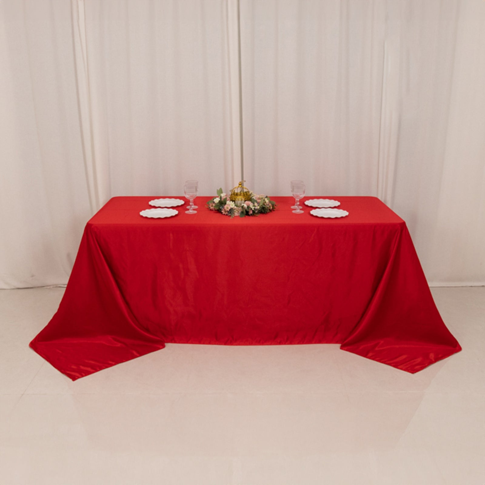 Red seamless satin tablecloth for a 6-foot table with floor-length drop.
