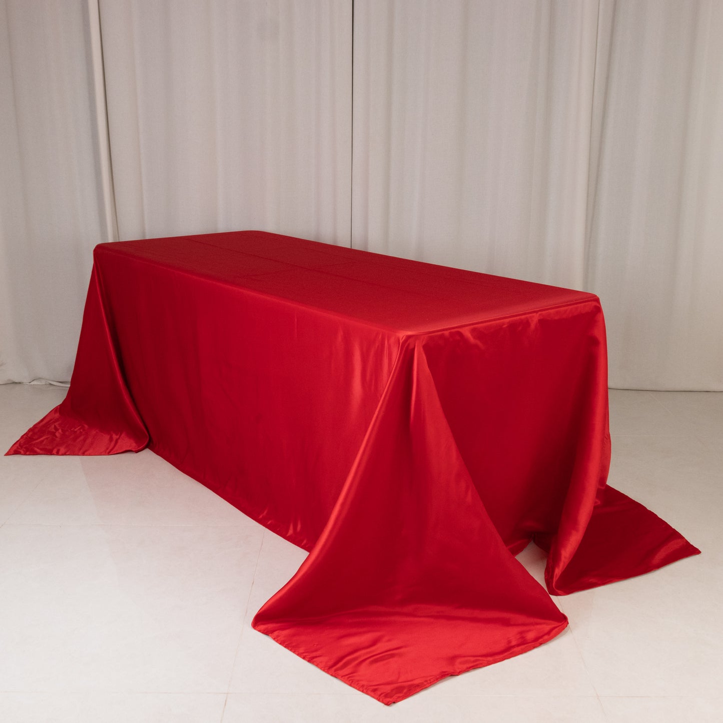 Red satin tablecloth for a 6-foot table with floor-length drop.