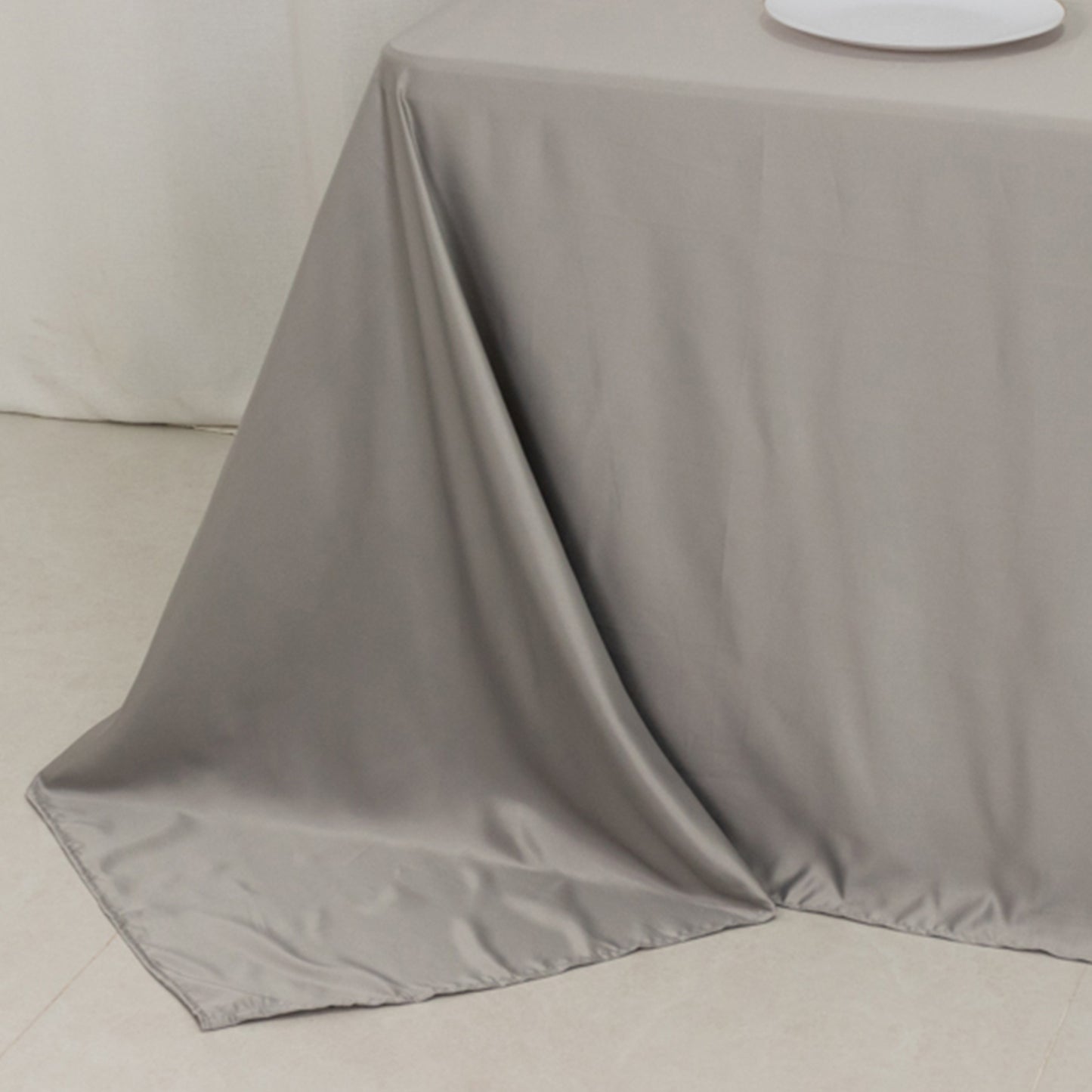 Silver satin tablecloth for 6-foot table with floor-length drop.