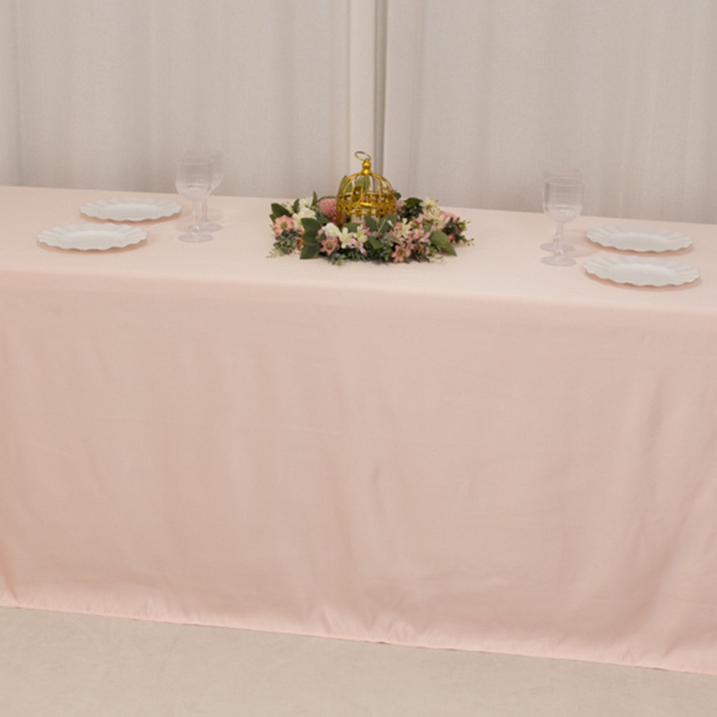 Blush satin tablecloth for 8-foot table with floor-length drop.