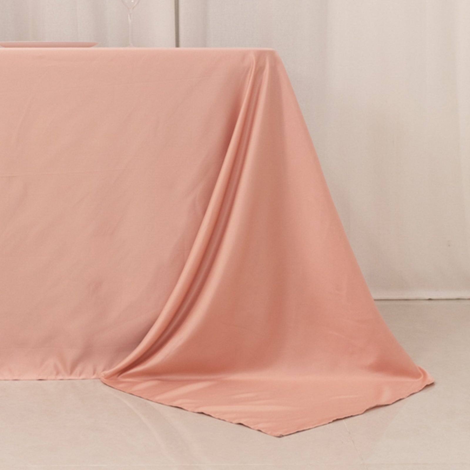 Dusty rose satin tablecloth for 8 foot table with floor-length drop.