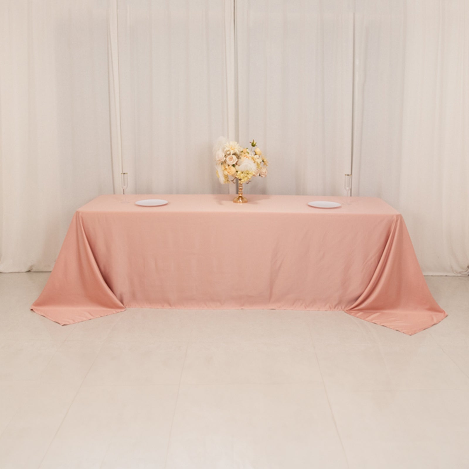 Dusty rose seamless satin tablecloth for 8-foot table with floor-length drop.