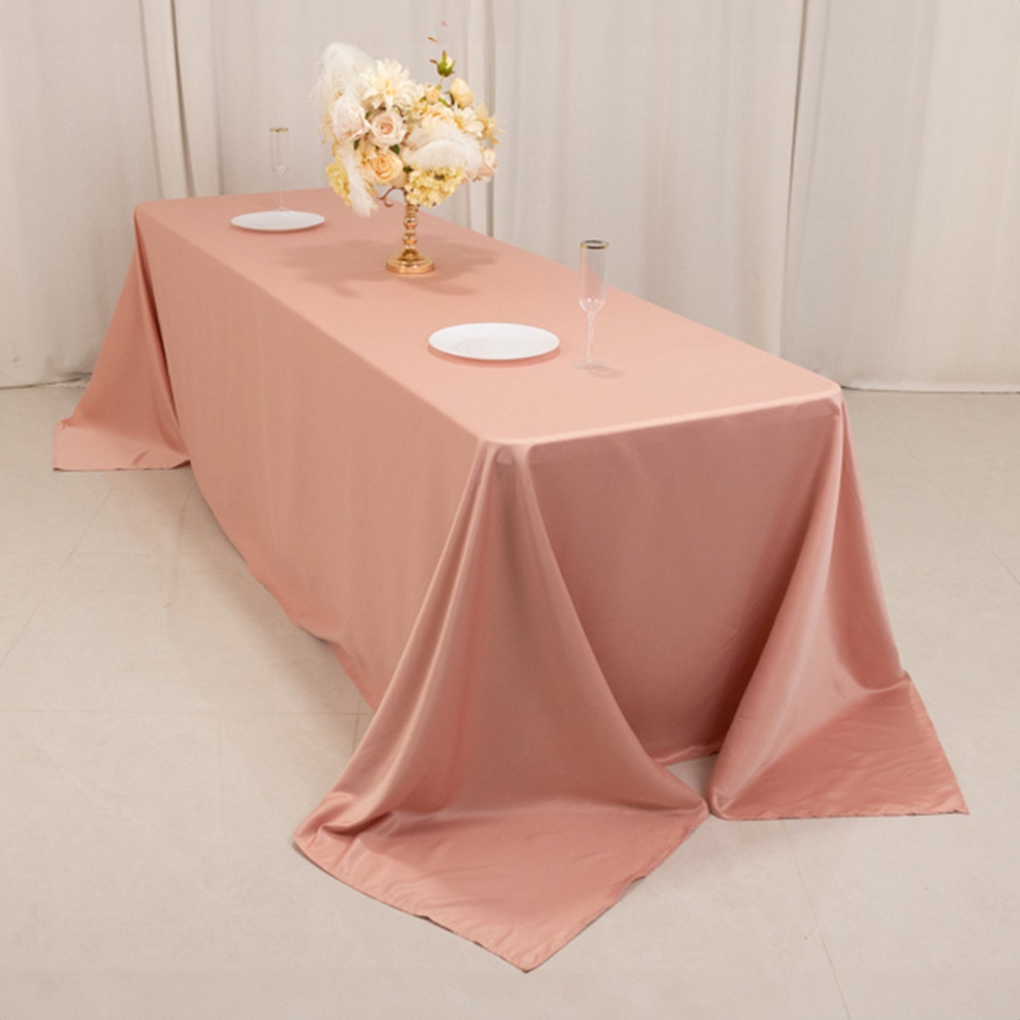 Dusty rose satin tablecloth for 8-foot table with floor-length drop.
