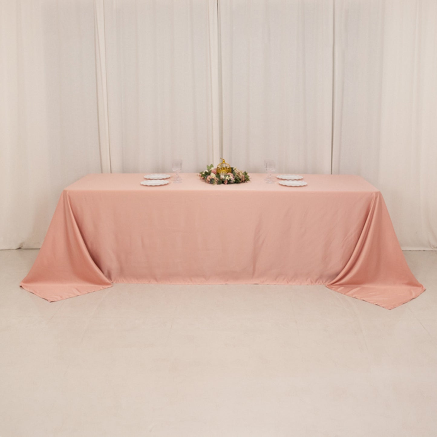 Dusty rose seamless satin tablecloth for 8-foot table with floor-length drop.