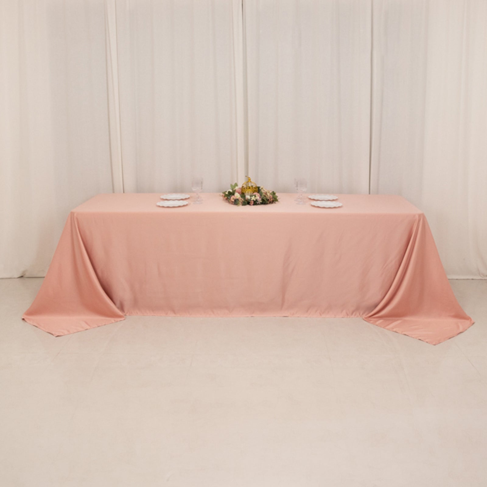 Dusty rose seamless satin tablecloth for 8-foot table with floor-length drop.
