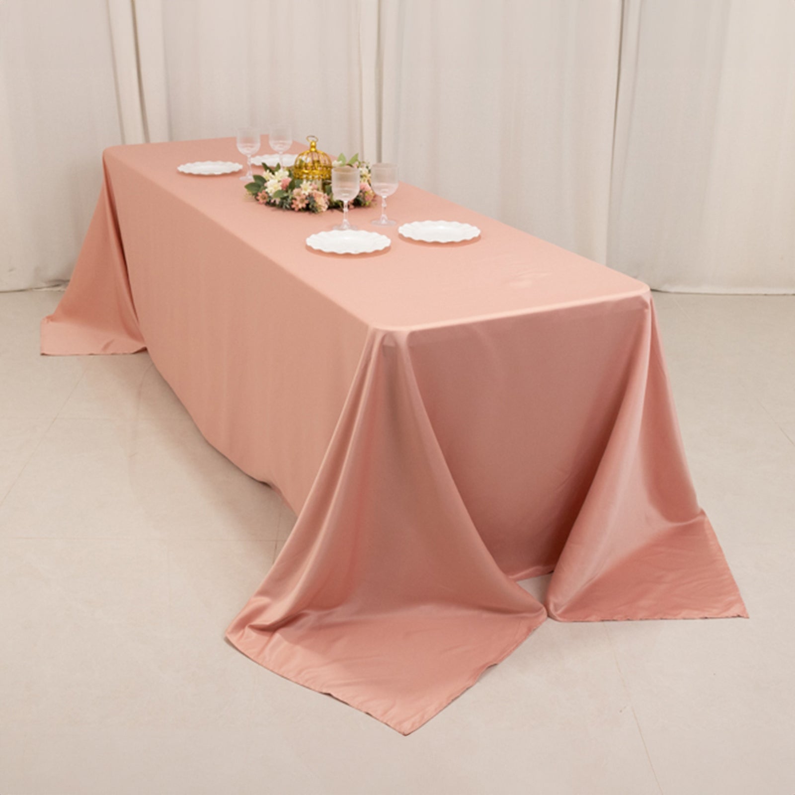 Dusty rose seamless satin tablecloth for 8-foot table with floor-length drop.