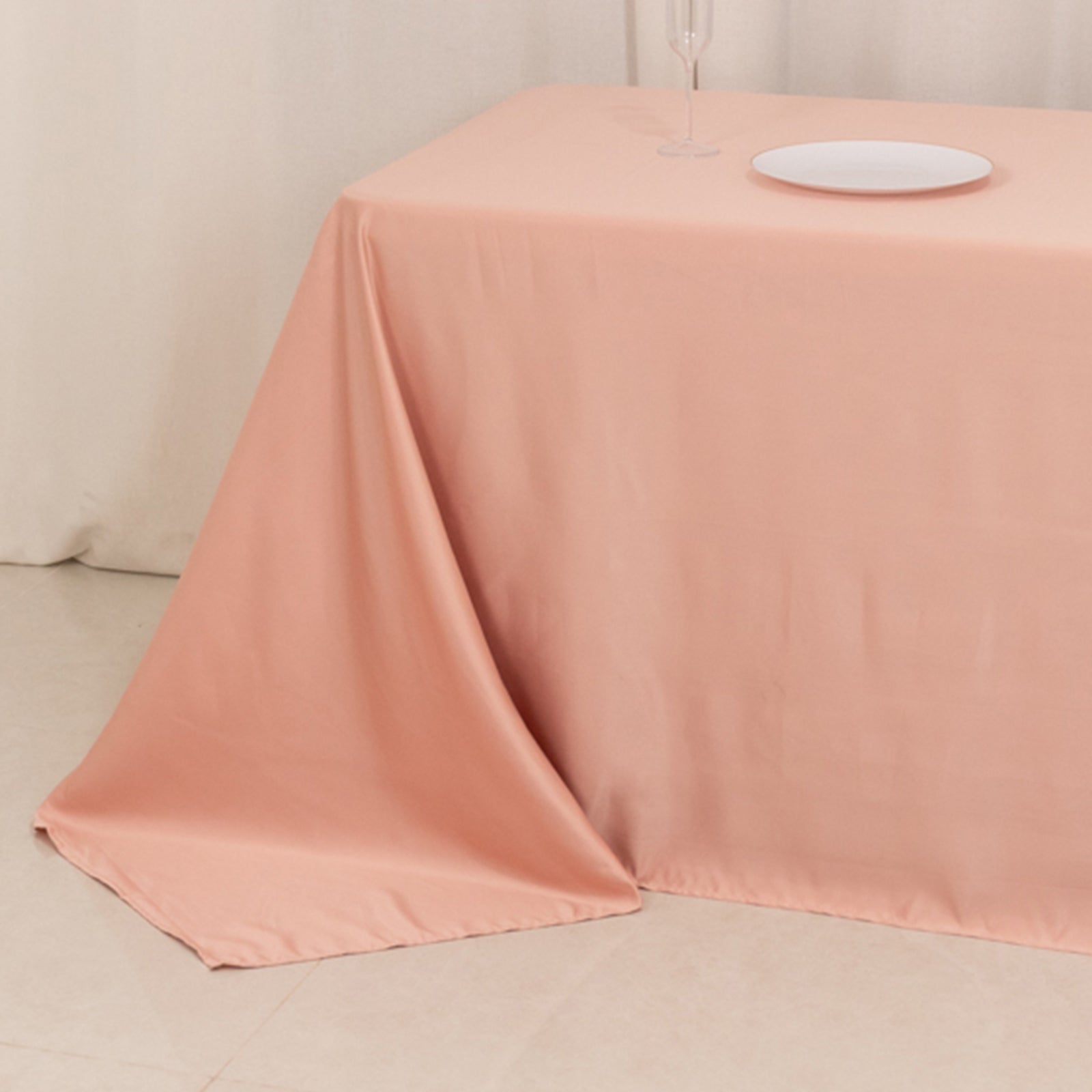 Dusty rose satin tablecloth for 8-foot table with floor-length drop.