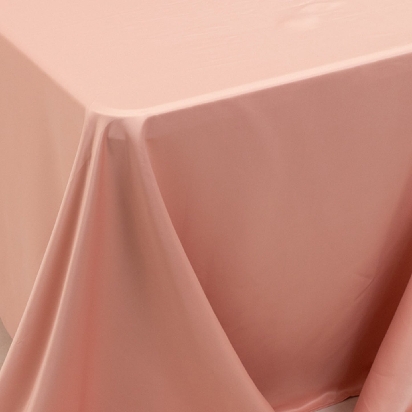 Dusty rose satin tablecloth for 8-foot table with floor-length drop.