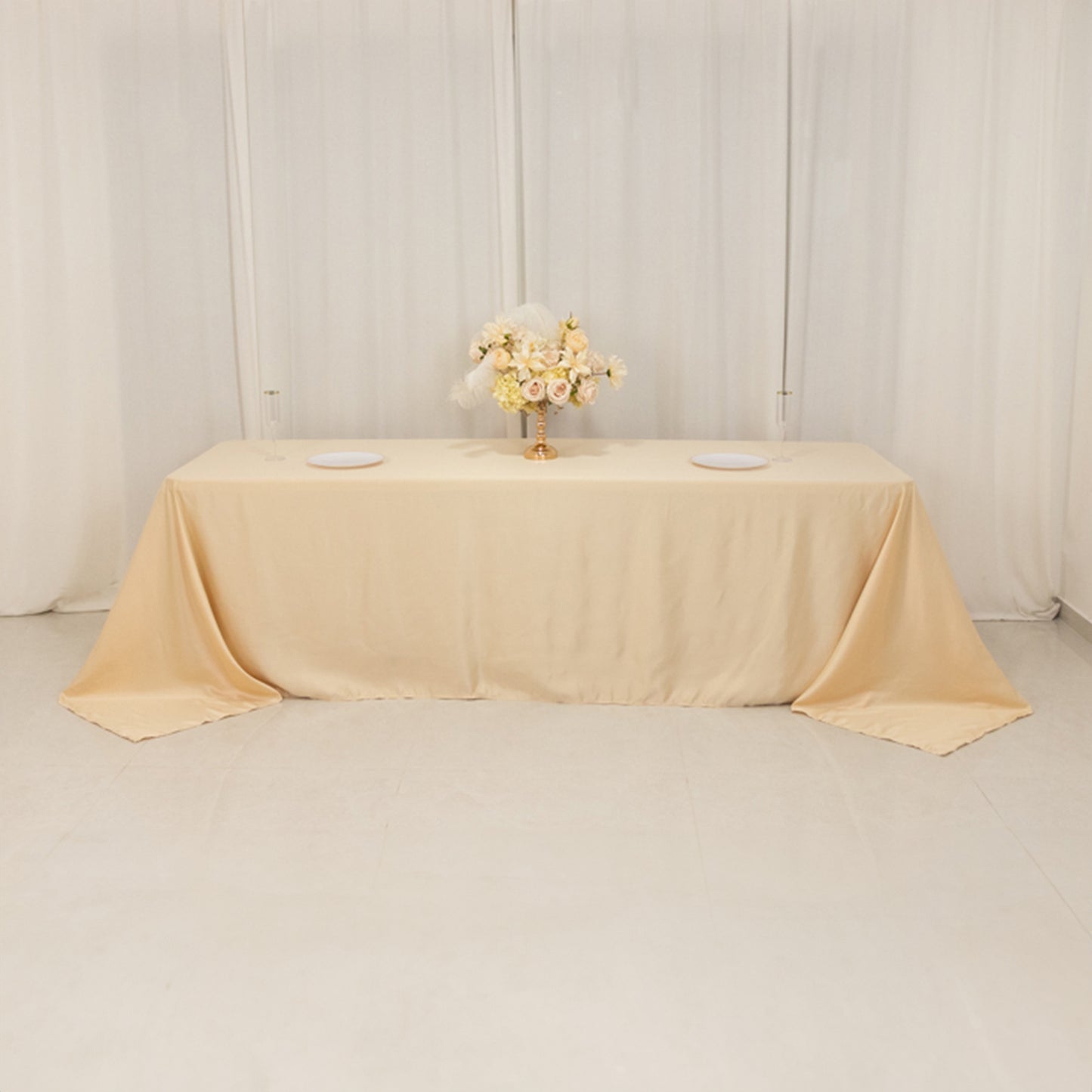 Beige satin tablecloth for 8-foot table with floor-length drop.