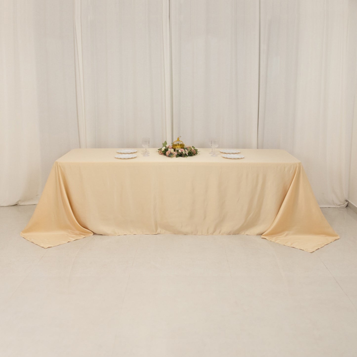 Beige seamless satin tablecloth for 8-foot table with floor-length drop.
