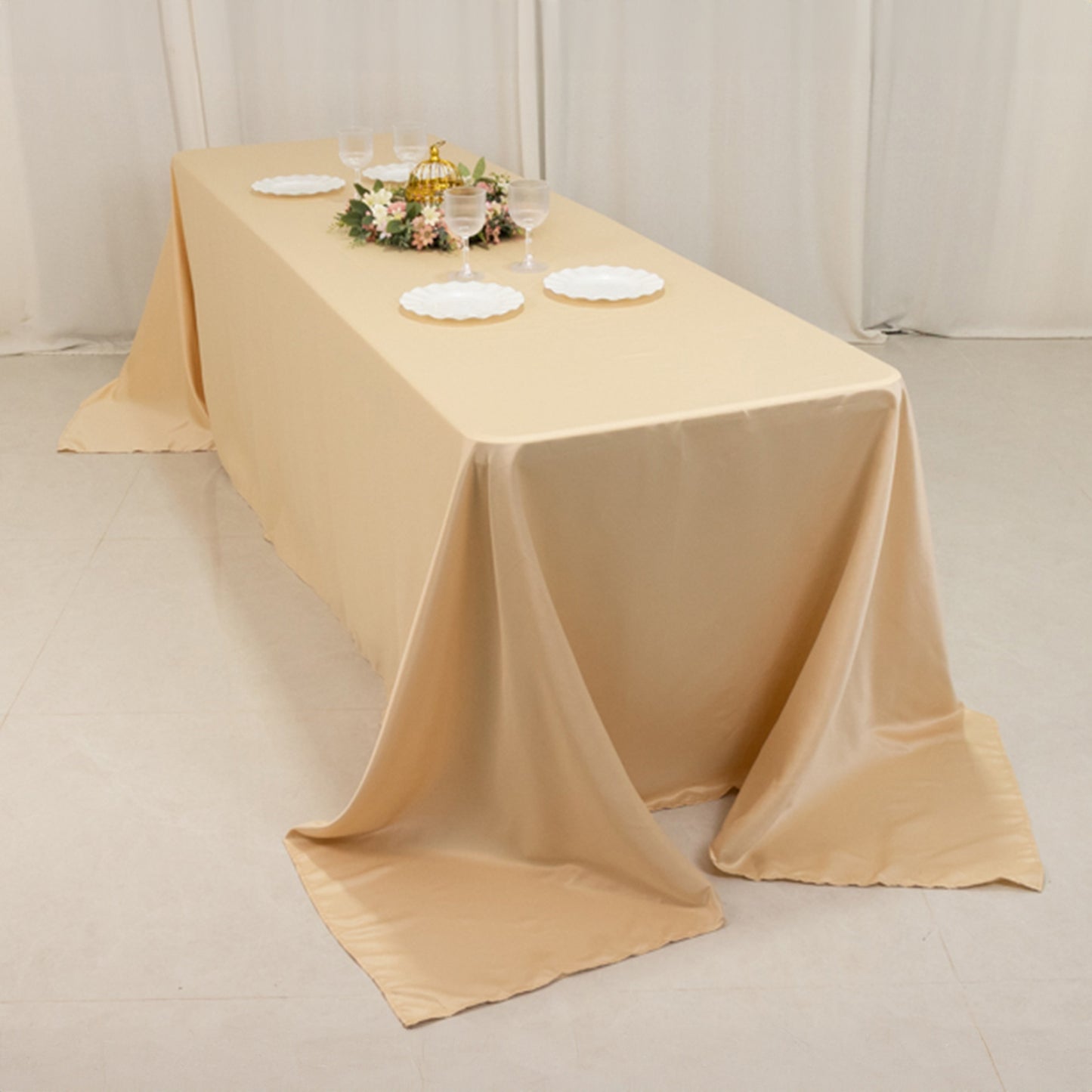 Beige seamless satin tablecloth for 8-foot table with floor-length drop.