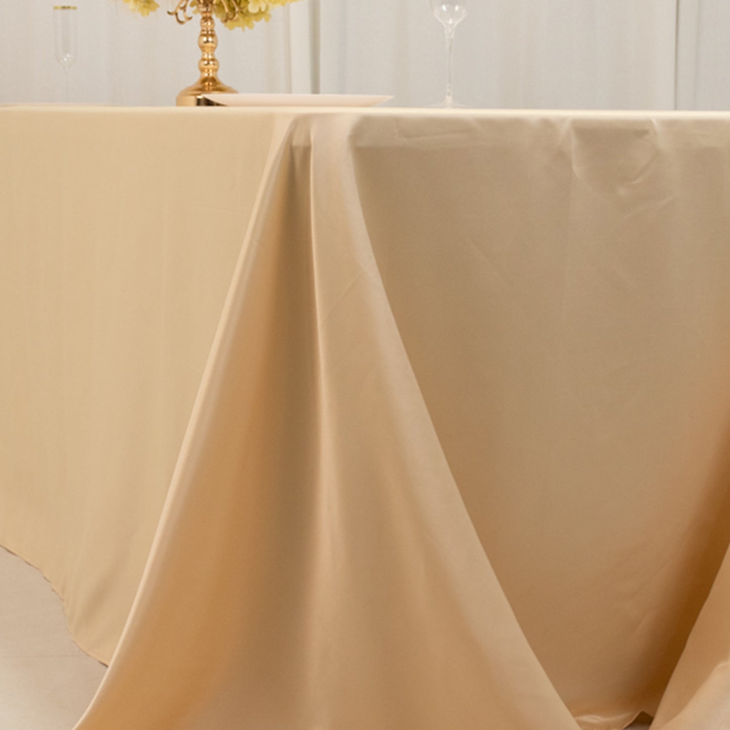 Beige satin tablecloth draped elegantly over an 8-foot table.