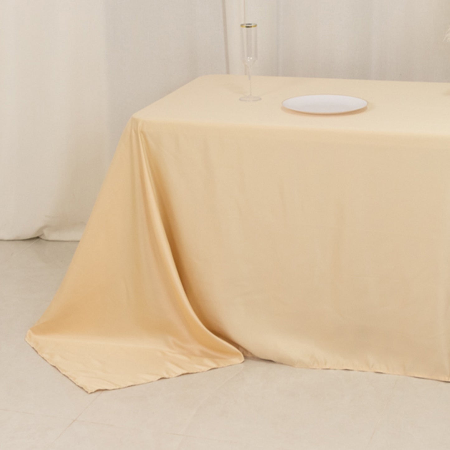 Beige satin tablecloth for 8-foot table with floor-length drop.