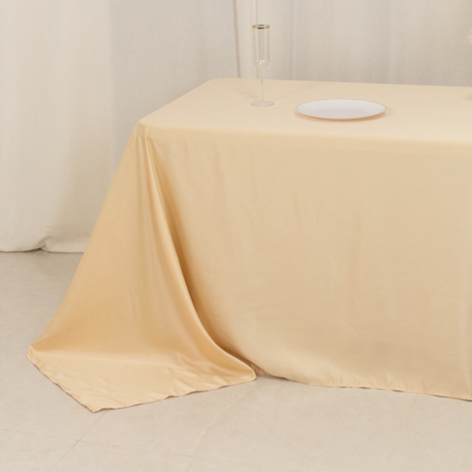 Beige satin tablecloth for 8-foot table with floor-length drop.