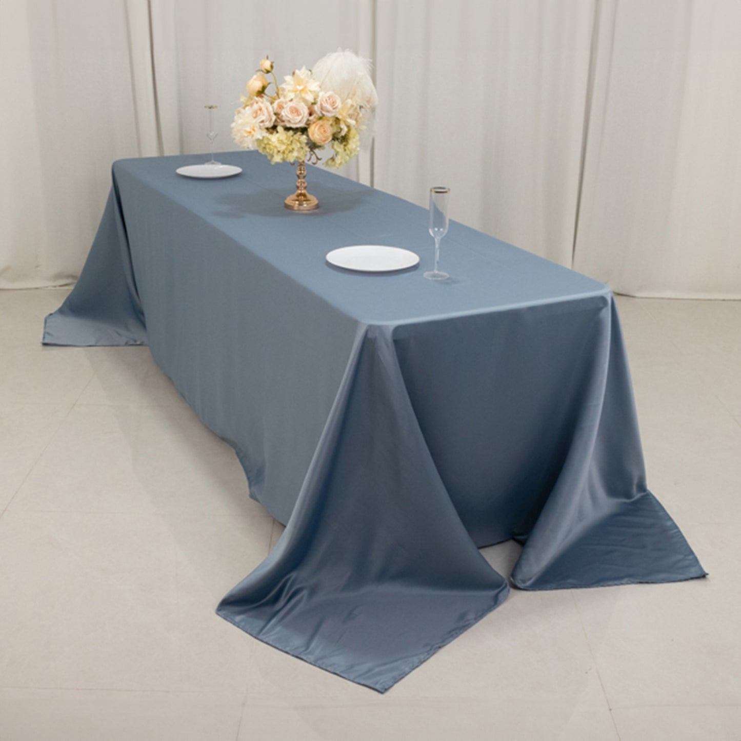 Dusty blue satin tablecloth for 8-foot table with floor-length drop.