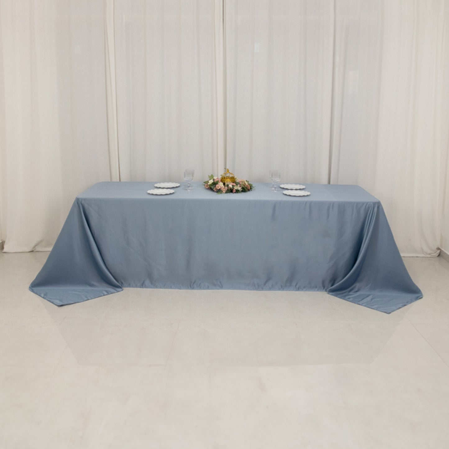 Dusty blue satin tablecloth for 8-foot table with floor-length drop.