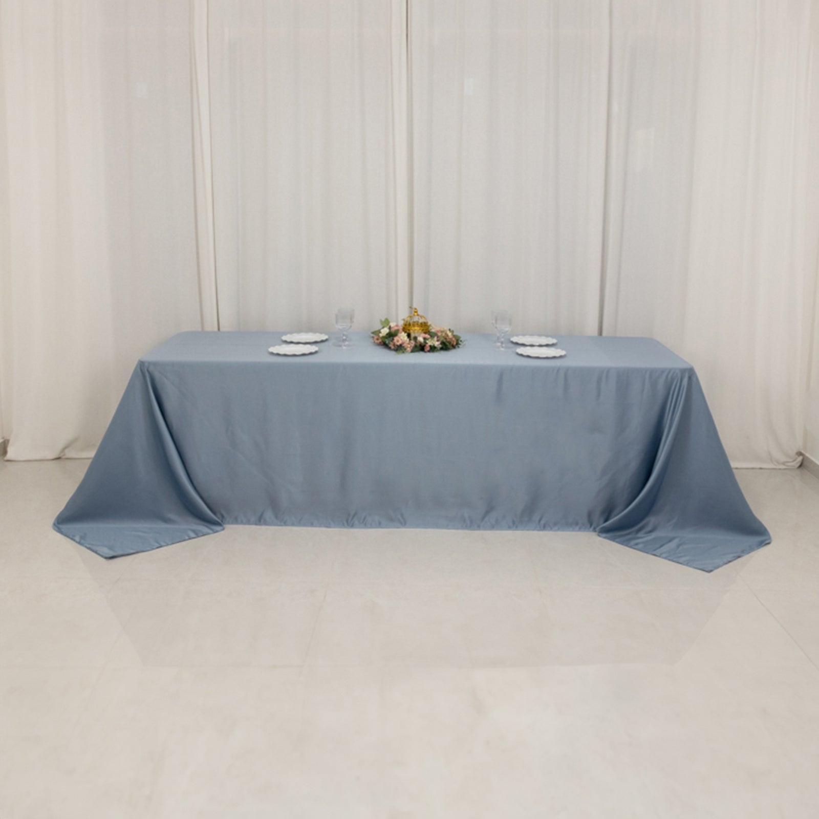 Dusty blue satin tablecloth for 8-foot table with floor-length drop.