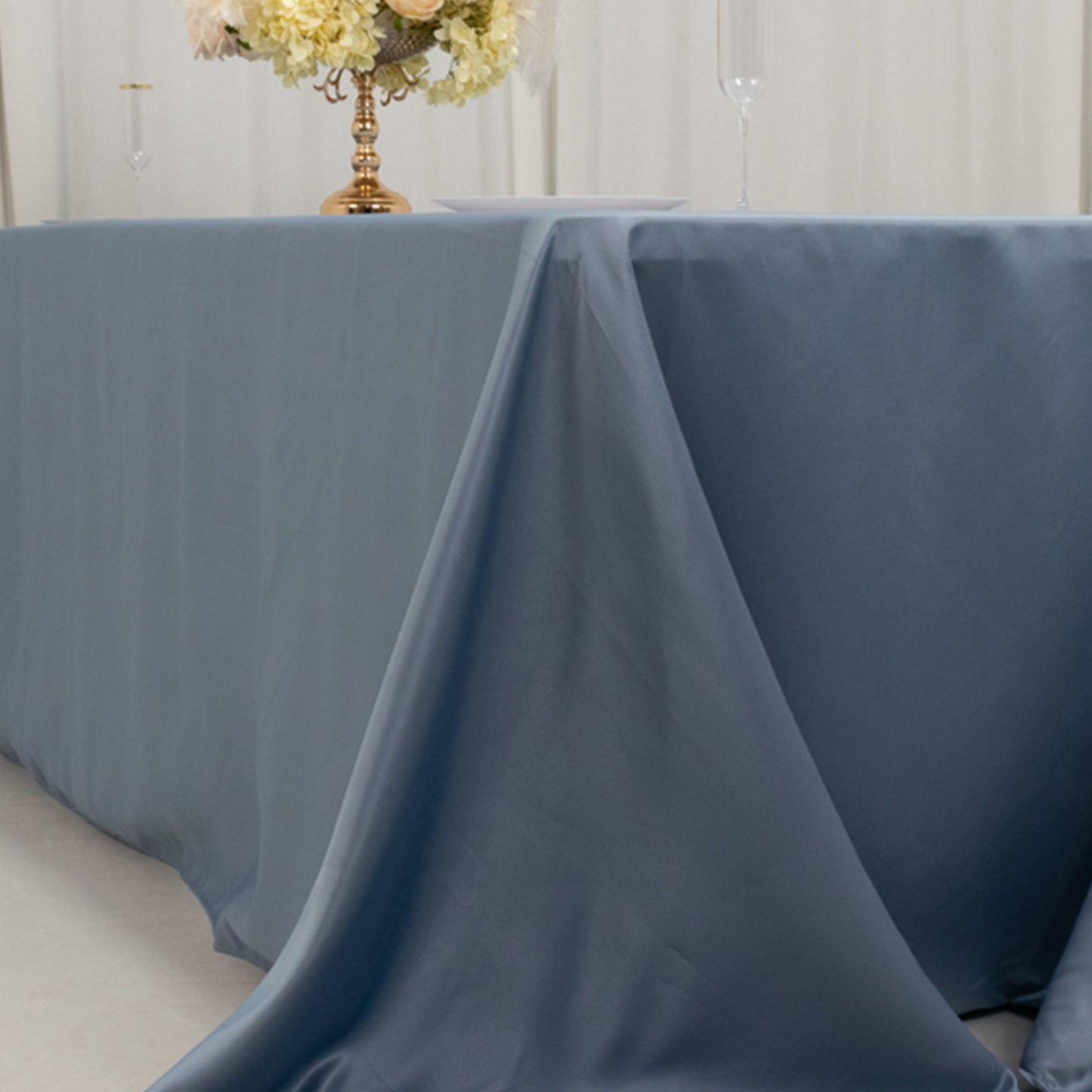 Dusty blue satin tablecloth for 8-foot table with floor-length drop.