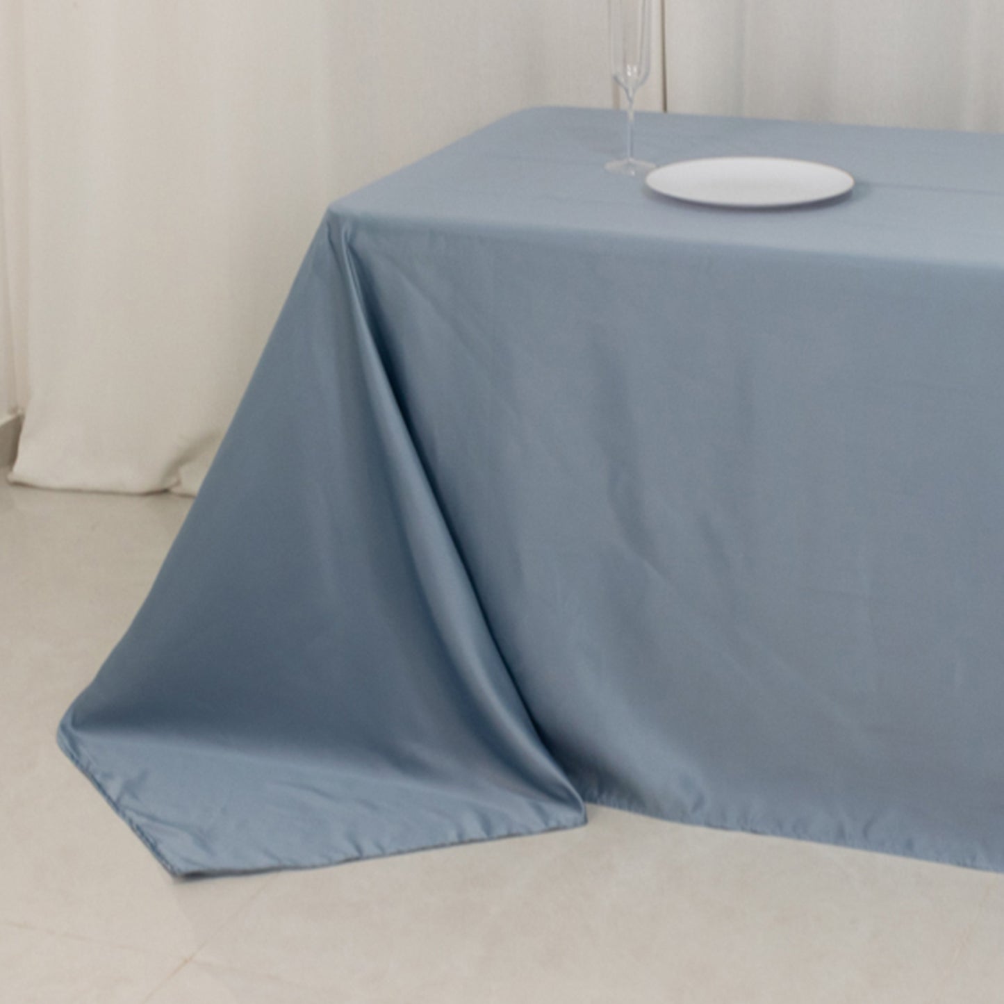 Dusty blue satin tablecloth for an 8-foot table with floor-length drop.