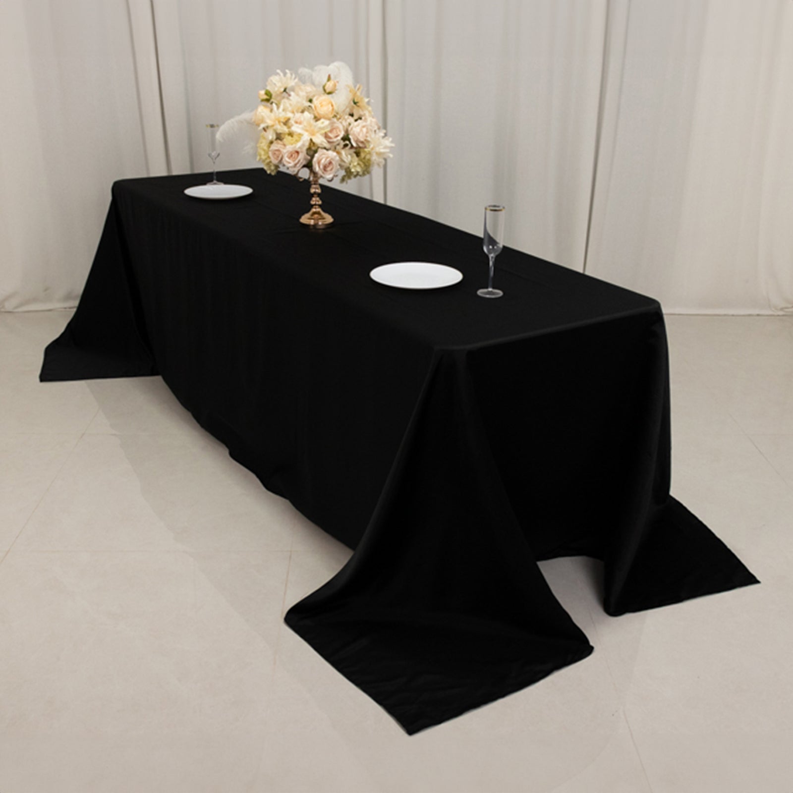 Black seamless satin tablecloth for an 8-foot table with a floor-length drop.