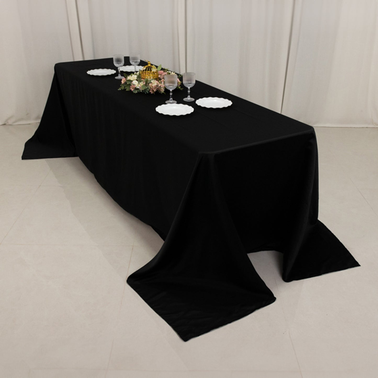 Black seamless satin tablecloth for an 8-foot table with a floor-length drop.