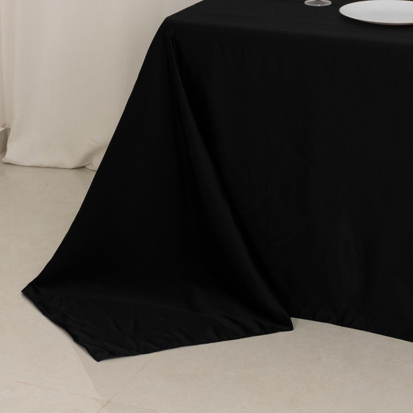 Black seamless lamour satin rectangle tablecloth for 8 foot table.