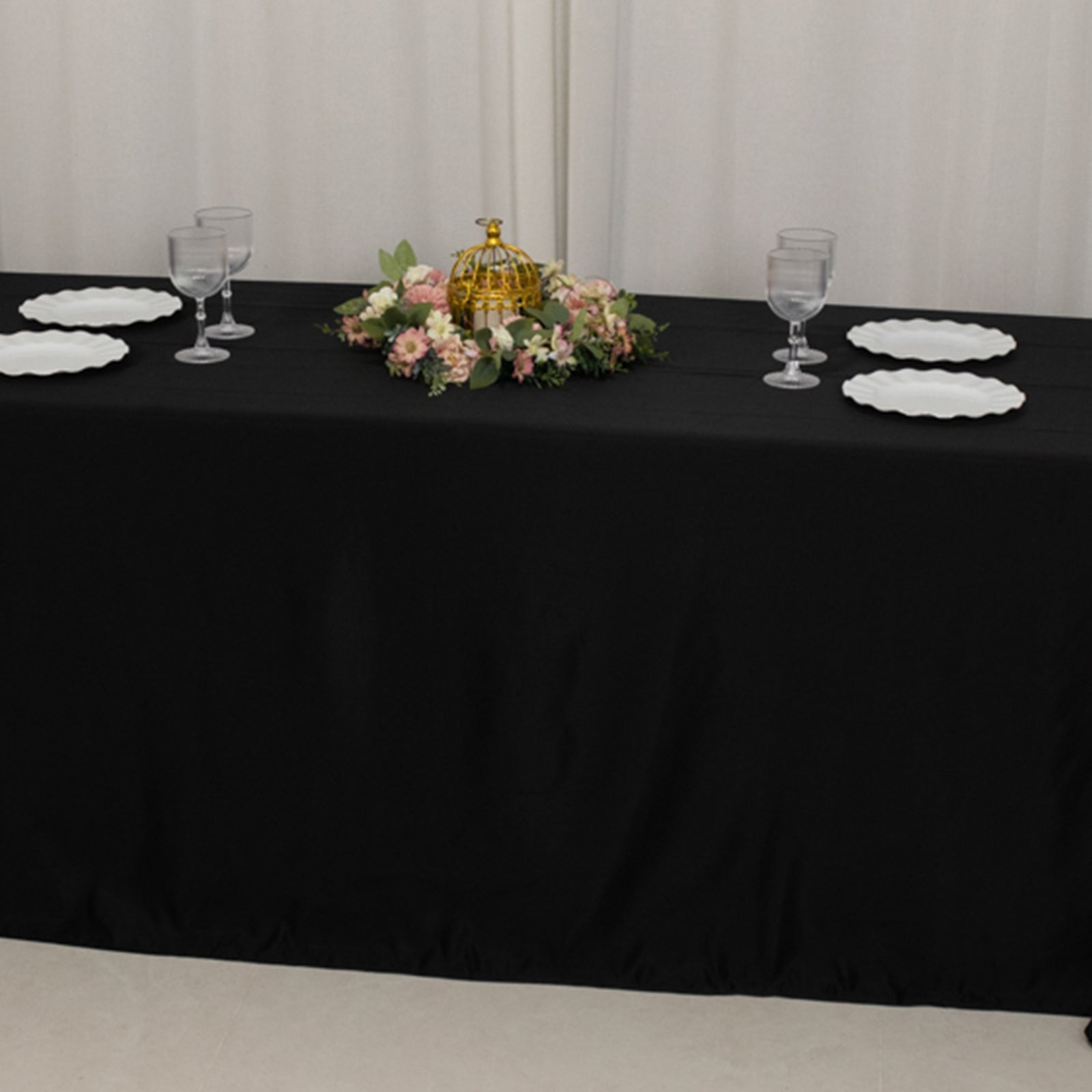 Black seamless satin tablecloth for 8-foot table with floor-length drop.