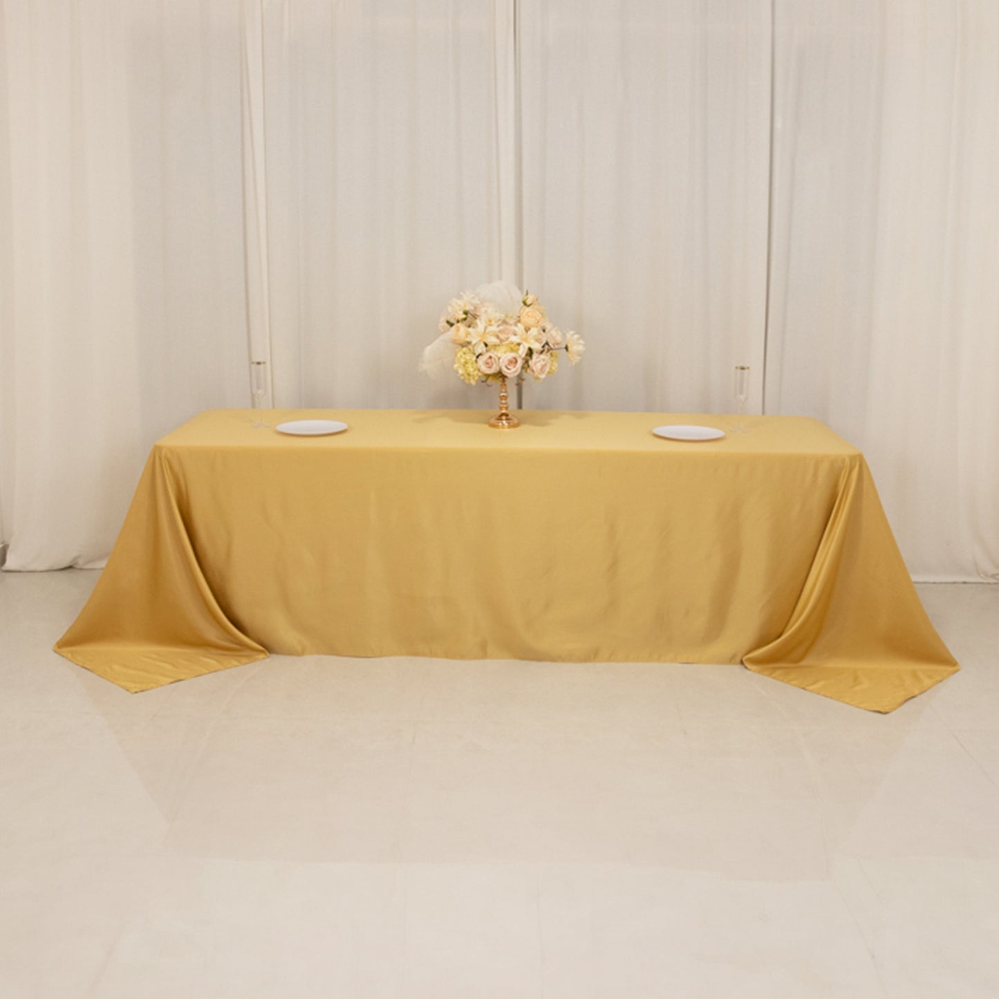 Champagne satin tablecloth for 8-foot table with floor-length drop.