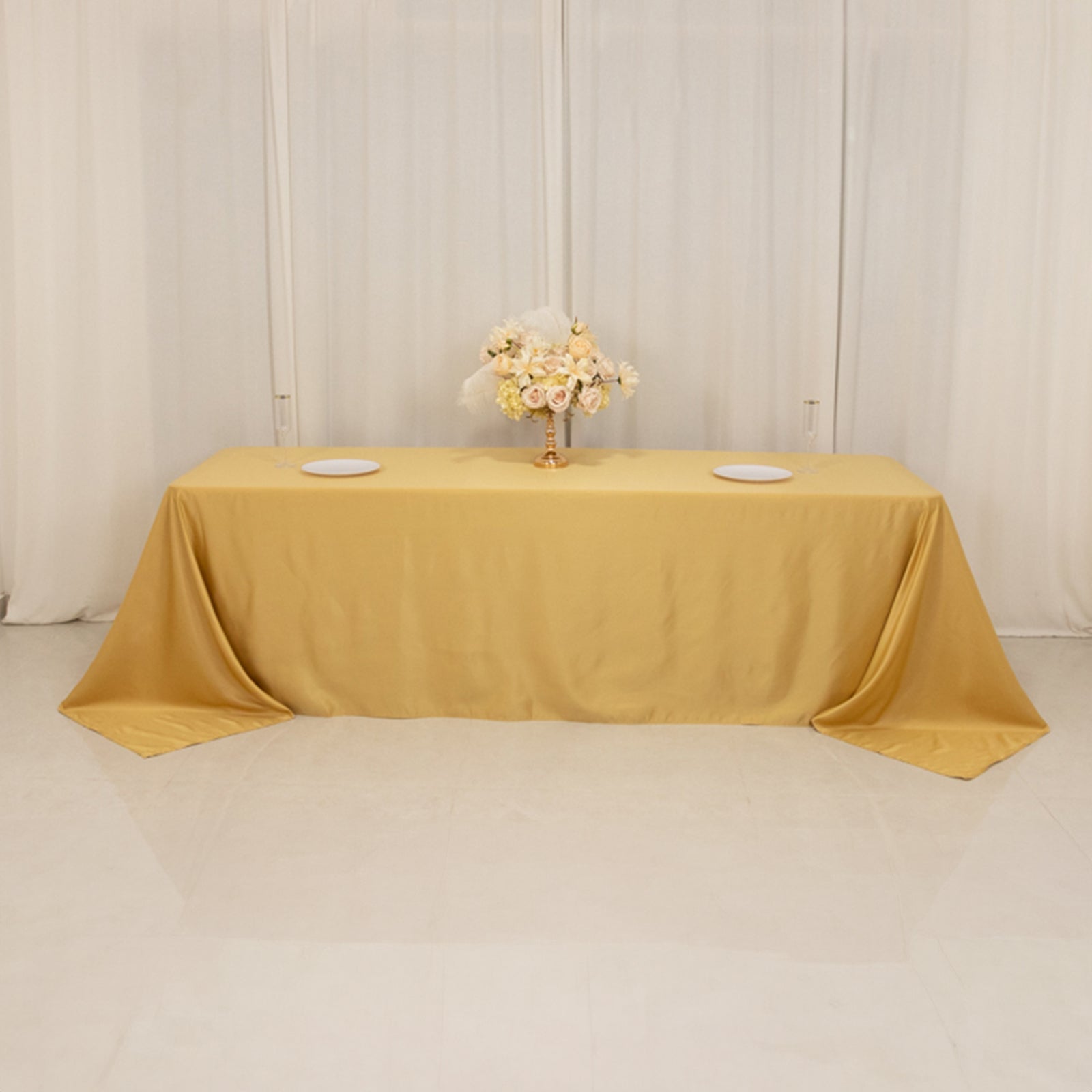 Champagne satin tablecloth for 8-foot table with floor-length drop.
