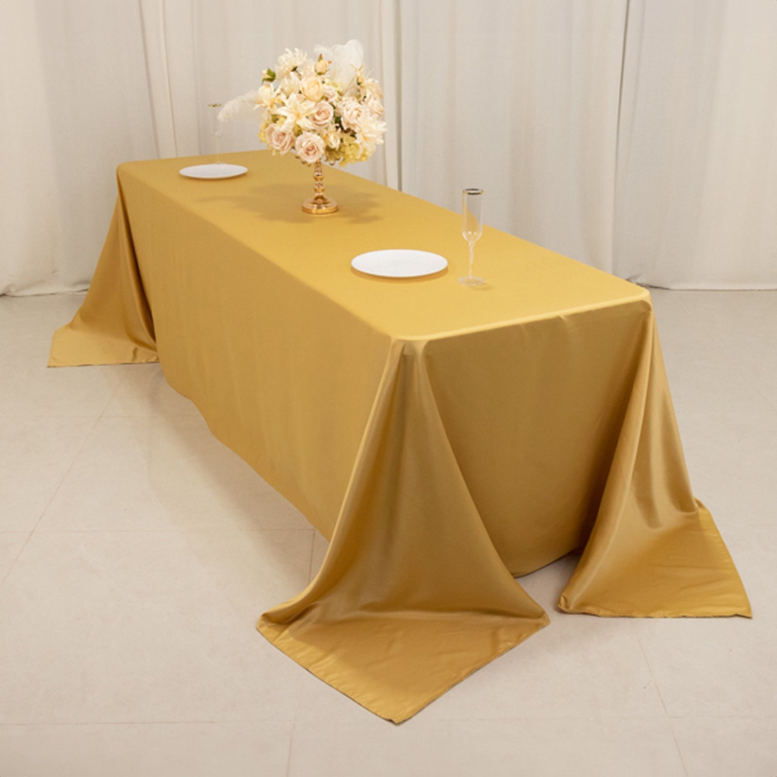 Champagne satin tablecloth for 8-foot table with floor-length drop.