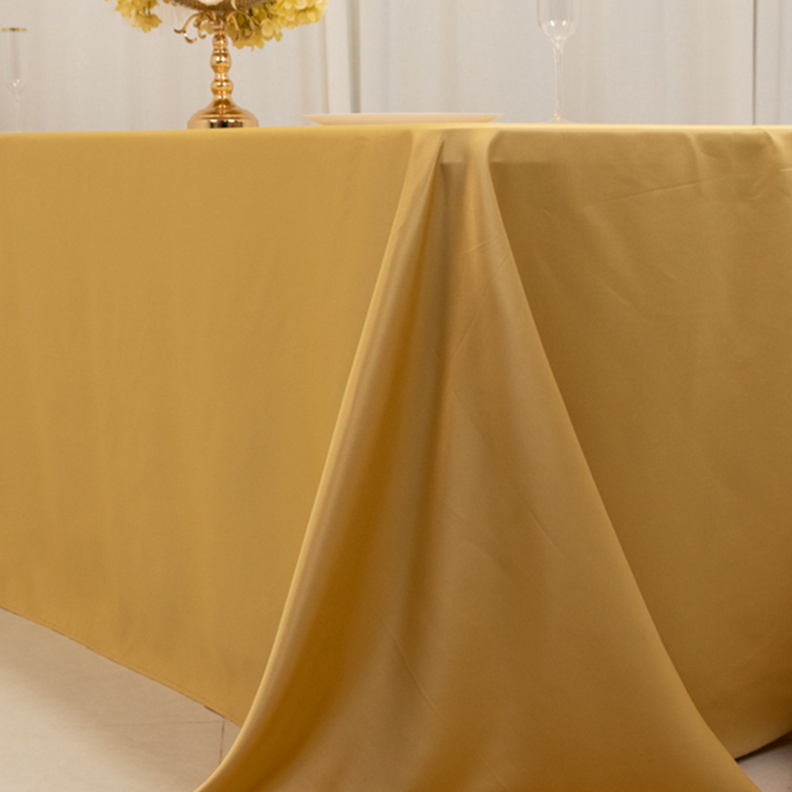 Champagne satin tablecloth for 8-foot table with floor-length drop.