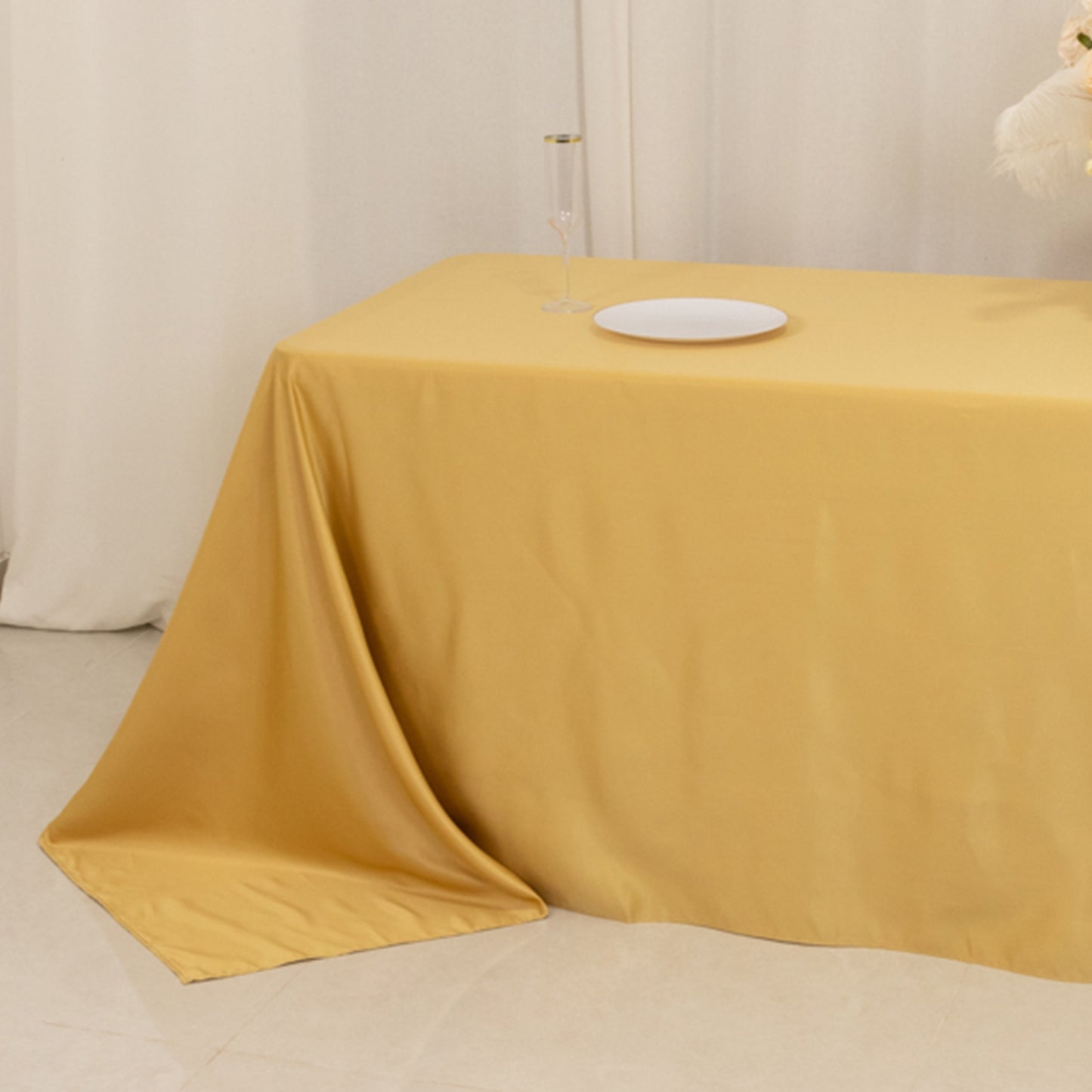 Champagne satin tablecloth for 8-foot table with floor-length drop.