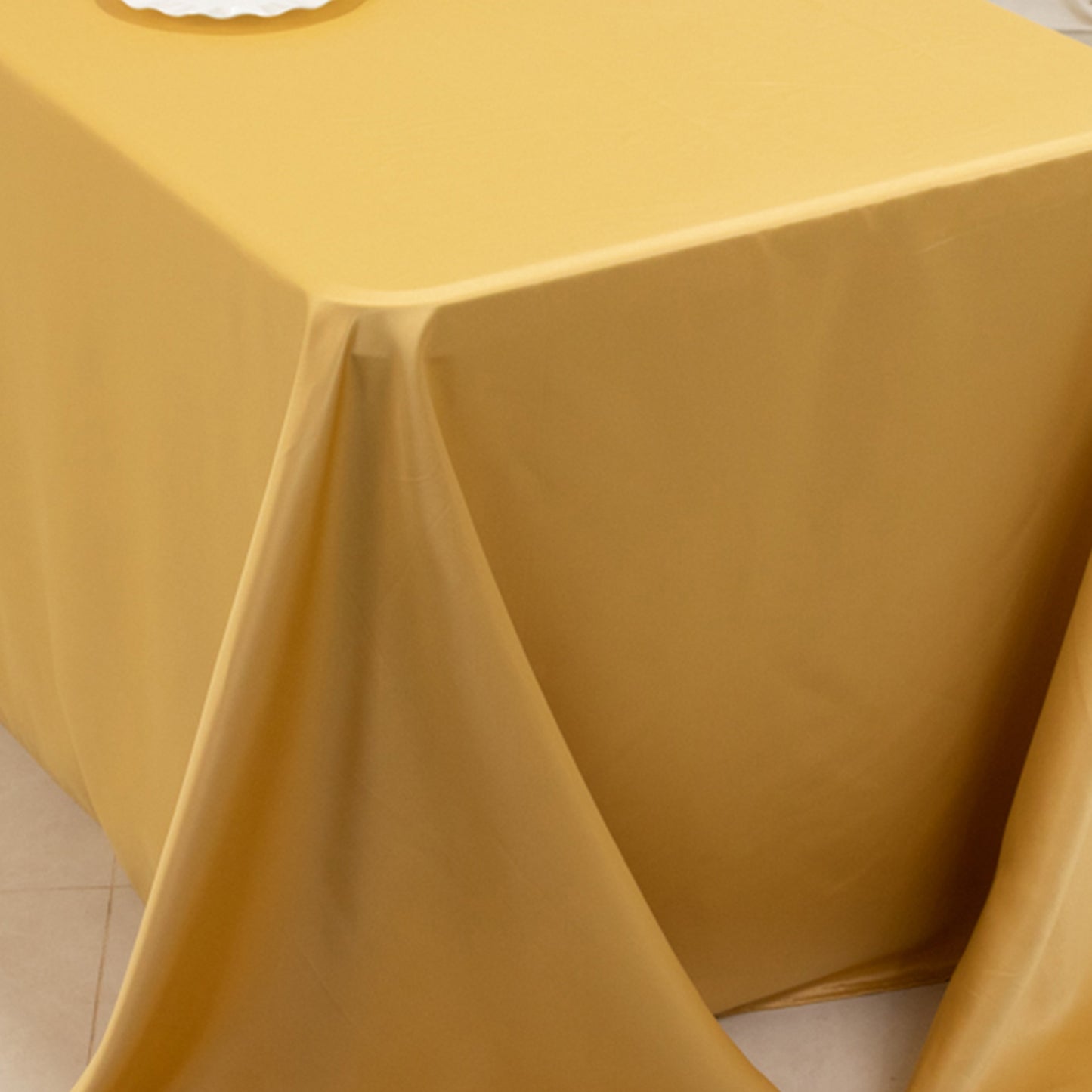 Champagne satin tablecloth for 8 foot table with floor-length drop.